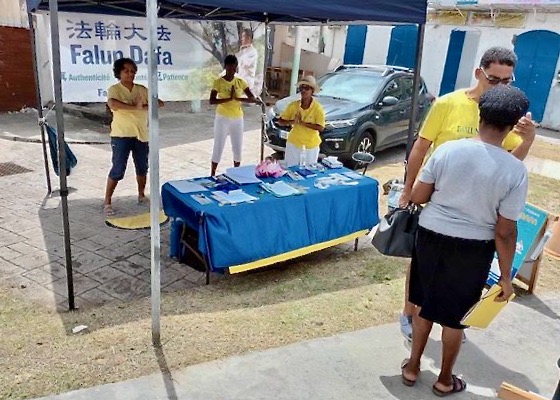 Image for article Карибские острова. Практикующие Фалунь Дафа разоблачают преступления КПК во время мероприятий, посвящённых 24-й годовщине мирного сопротивления преследованию в Китае